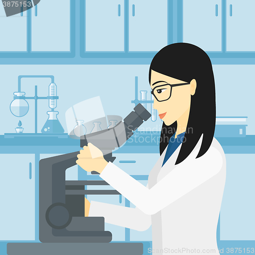Image of Laboratory assistant with microscope.