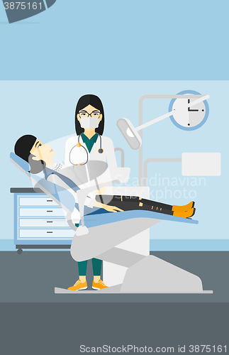 Image of Dentist and woman in dentist chair.