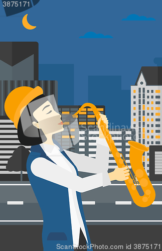 Image of Woman playing saxophone.