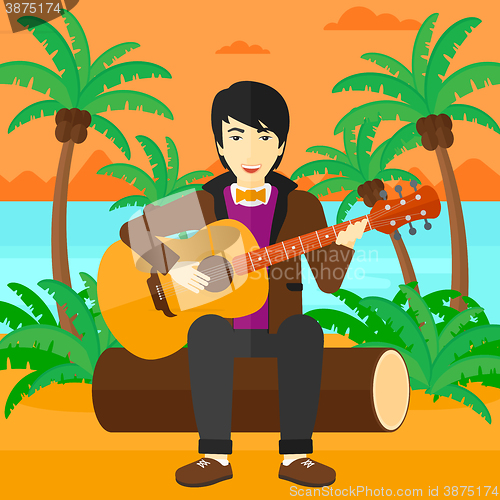 Image of Man playing guitar.