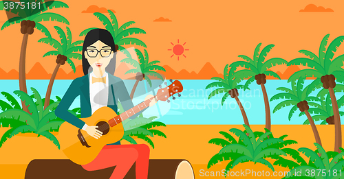 Image of Woman playing guitar.