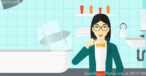 Image of Woman brushing teeth.