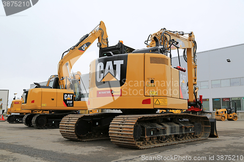 Image of Cat Hydraulic Excavators on a Yard