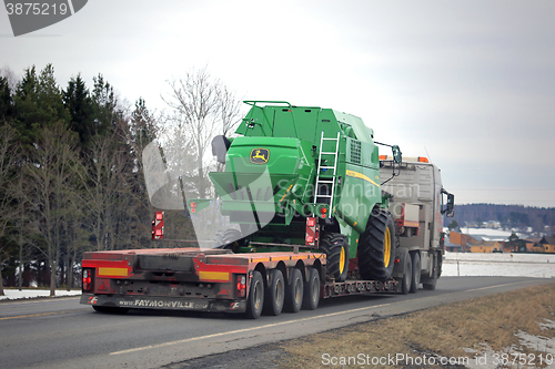 Image of John Deere W330 Compact Combine on Lowboy Trailer