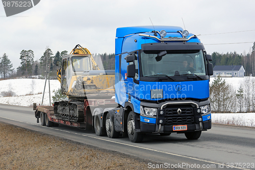 Image of Blue Renault Trucks T Hauls Construction Equipment