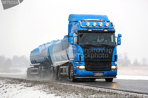 Image of Blue Scania Tank Truck Trucking in Snowfall