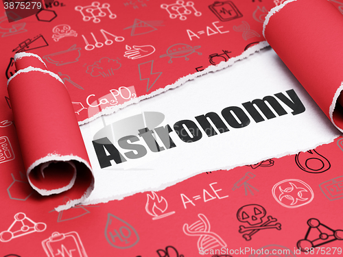 Image of Science concept: black text Astronomy under the piece of  torn paper