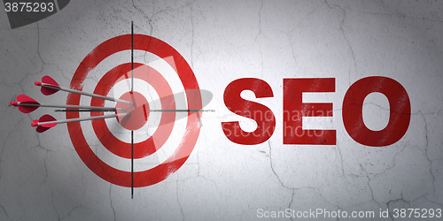 Image of Web development concept: target and SEO on wall background