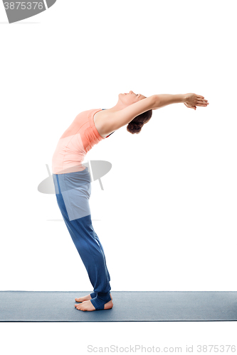 Image of Sporty fit woman practices yoga asana Anuvittasana