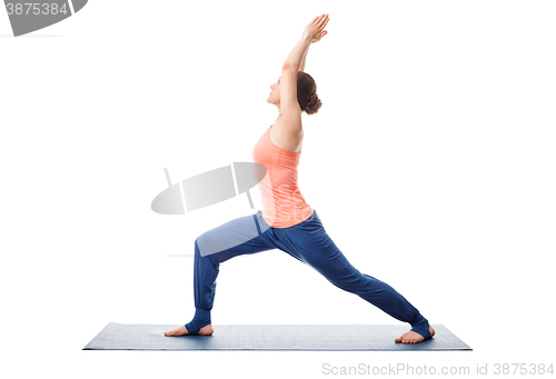 Image of Woman practices yoga Warrior asana