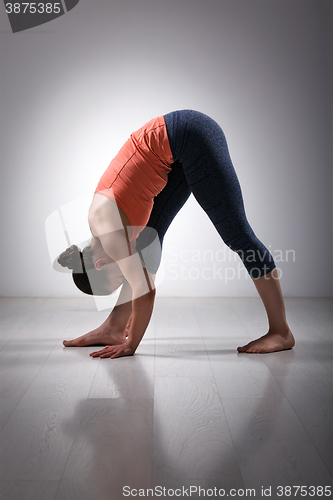 Image of Woman stretching in Ashtanga Vinyasa yoga asana