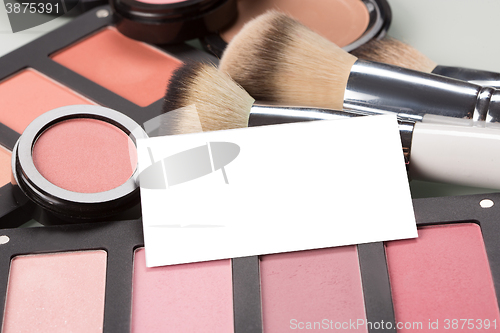 Image of makeup cosmetics for eyes and bussiness card