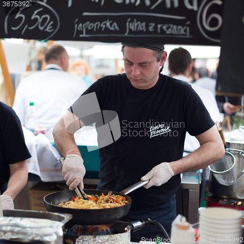 Image of Women serving hamburgers on food festival in Ljubljana, Slovenia.