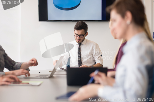 Image of young business people group on team meeting at modern office