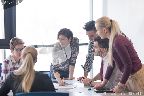 Image of young business people group on meeting at modern office