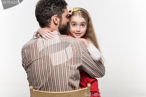 Image of Girl hugging her father  over a white background