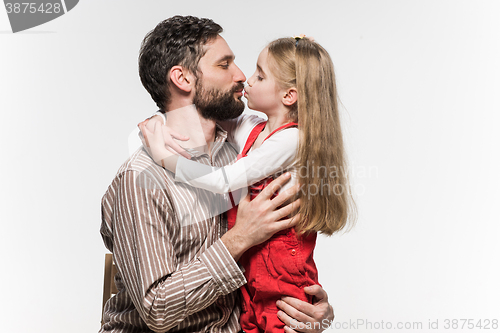 Image of Girl hugging her father  over a white background