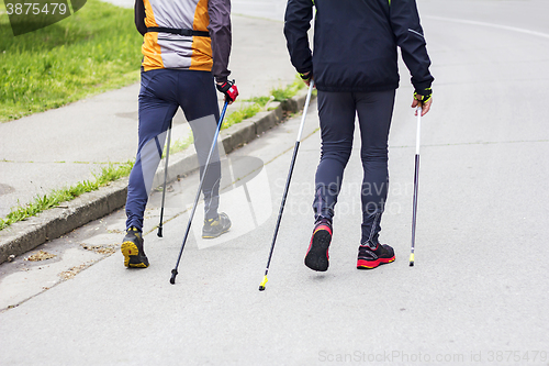 Image of Two men nordic walking