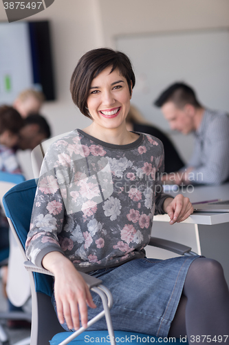 Image of portrait of young business woman at office with team on meeting 