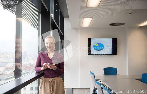 Image of young business woman using smart phone