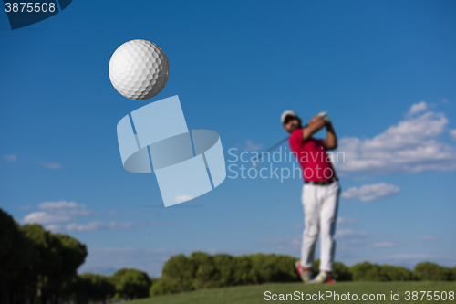 Image of golf player hitting long shot