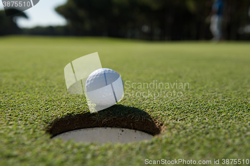 Image of golf ball in the hole