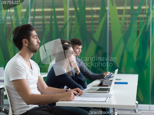 Image of group of students study together in classroom