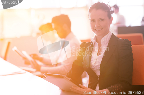 Image of business woman at  office people group on meeting  in background