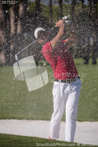 Image of golfer hitting a sand bunker shot