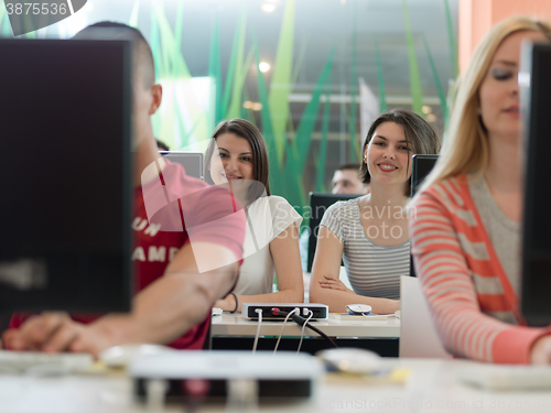Image of technology students group in computer lab school  classroom