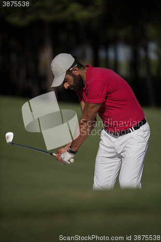 Image of golfer hitting a sand bunker shot