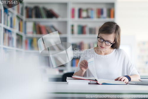 Image of female student study in school library