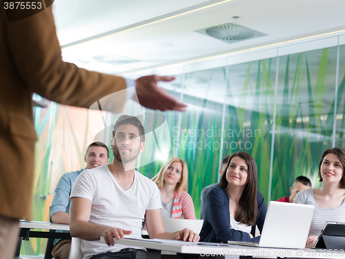 Image of close up of teacher hand while teaching in classroom