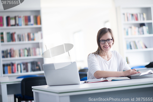 Image of female student study in school library