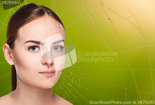 Image of The woman face  with arrows over green background as web