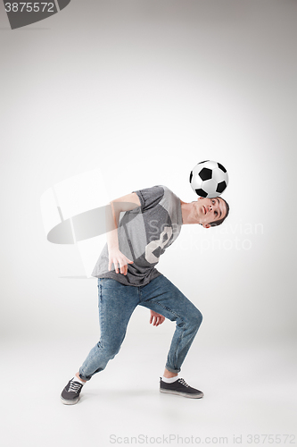 Image of The guy with ball on gray background