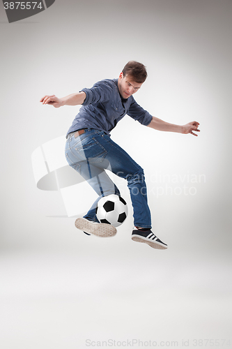 Image of The guy with ball on gray background