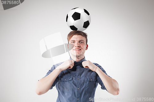 Image of The guy with ball on gray background