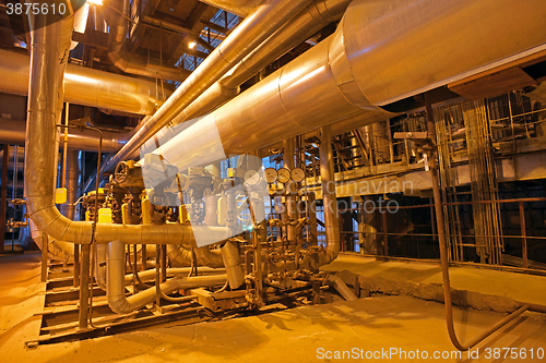 Image of Equipment, cables and piping as found inside of a modern industr