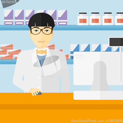 Image of Pharmacist at counter with cash box.