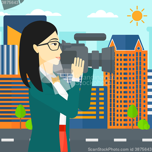 Image of Camerawoman with video camera.