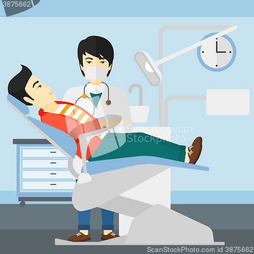 Image of Dentist and man in dentist chair.