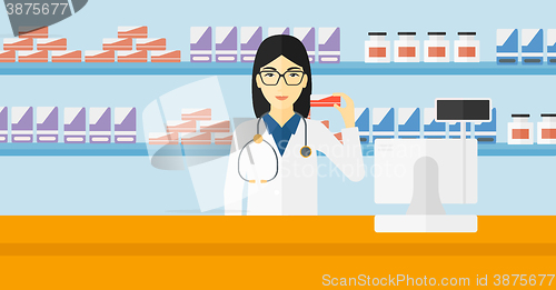 Image of Pharmacist showing some medicine.
