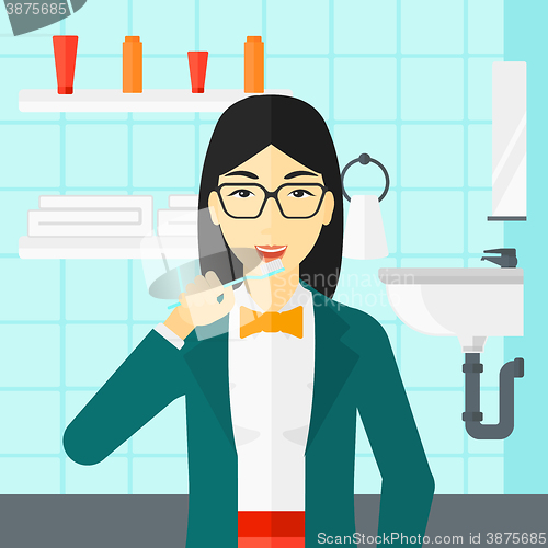 Image of Woman brushing teeth.