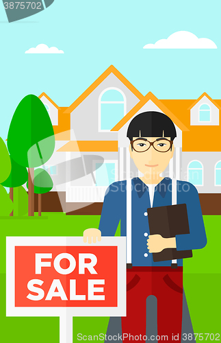 Image of Real estate agent offering house.