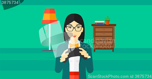 Image of Woman playing video game.