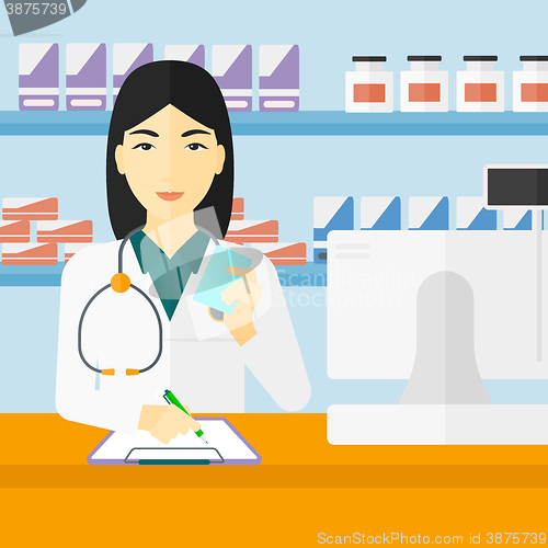 Image of Pharmacist taking notes.