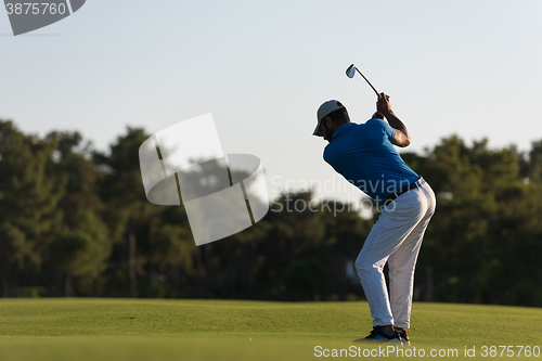 Image of golfer hitting long shot