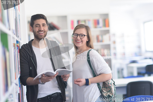 Image of students couple  in school  library