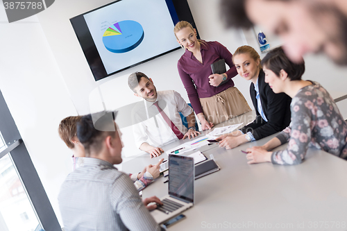 Image of young business people group on meeting at modern office